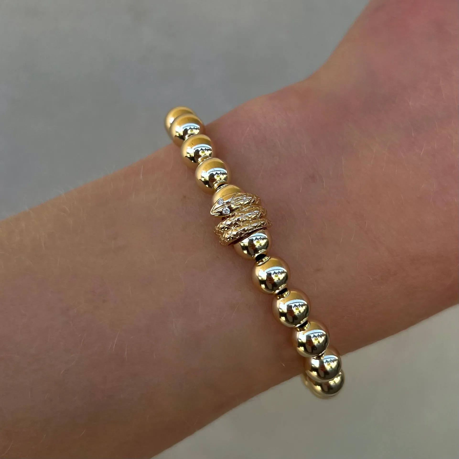 7mm Signature Bracelet with a 14k Snake Rondelle