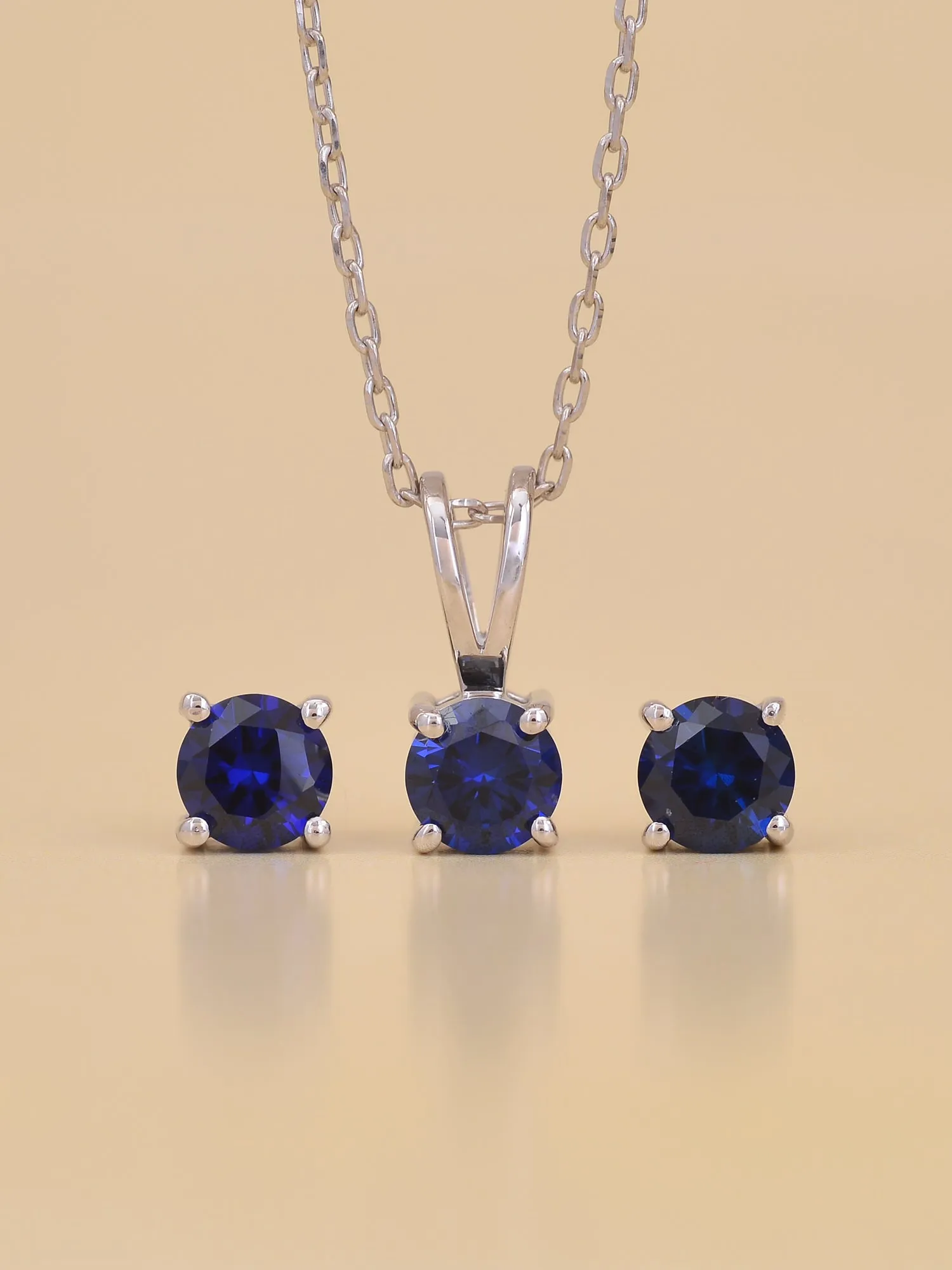 Ornate Jewels Blue Sapphire Solitaire Necklace With Earrings